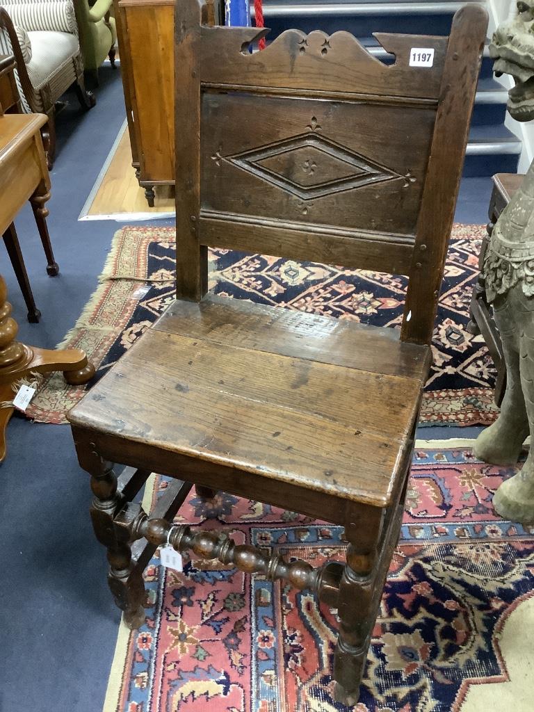 A 17th century oak back stool with lozenge carved decoration, width 47cm, depth 39cm, height 98cm